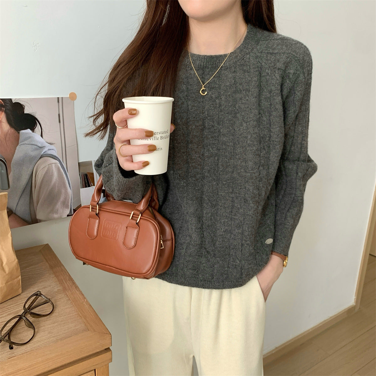 Round neck long sleeved knitted sweater for women in autumn and winter
